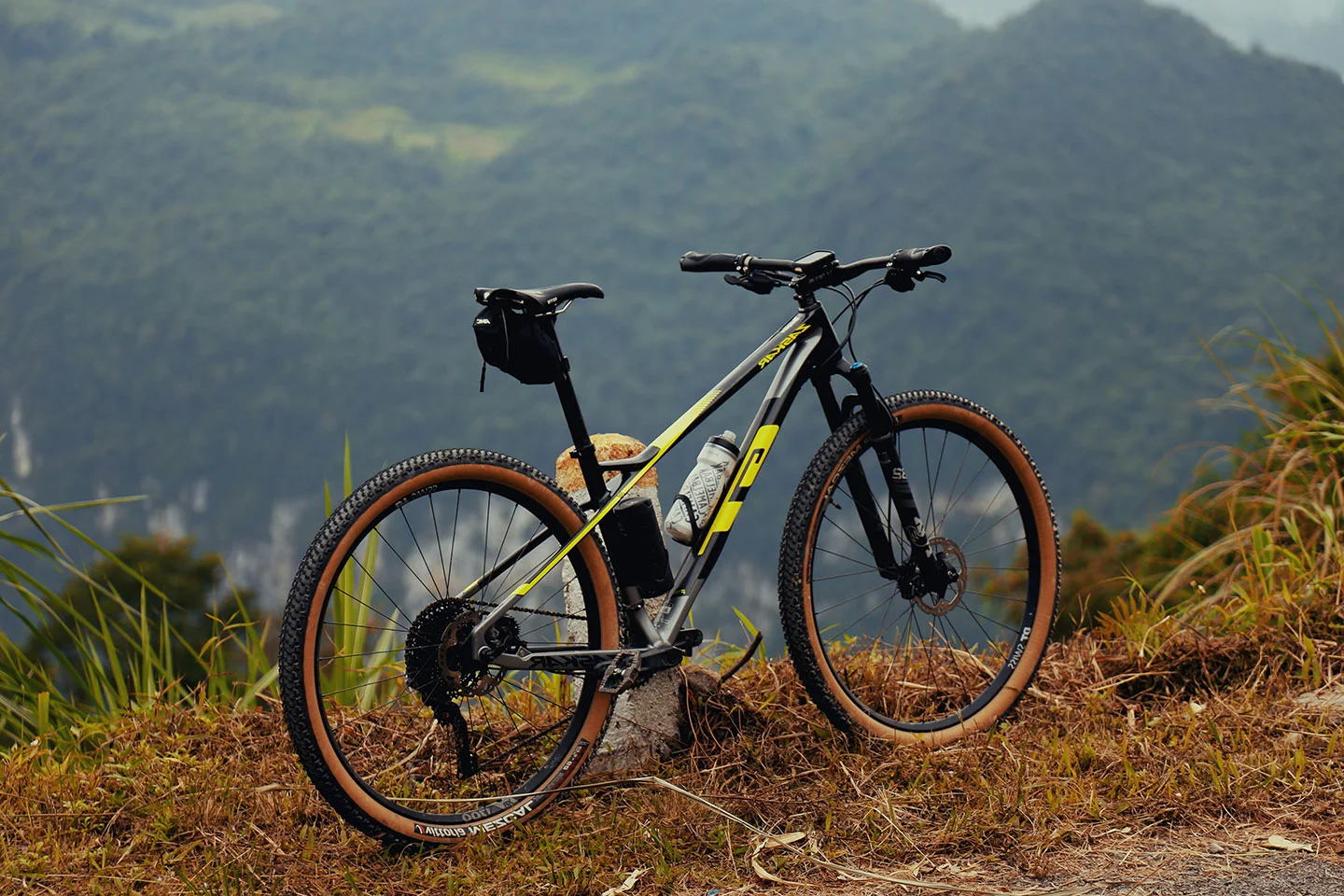  mountian bike, on the biking trail ontop of a hill