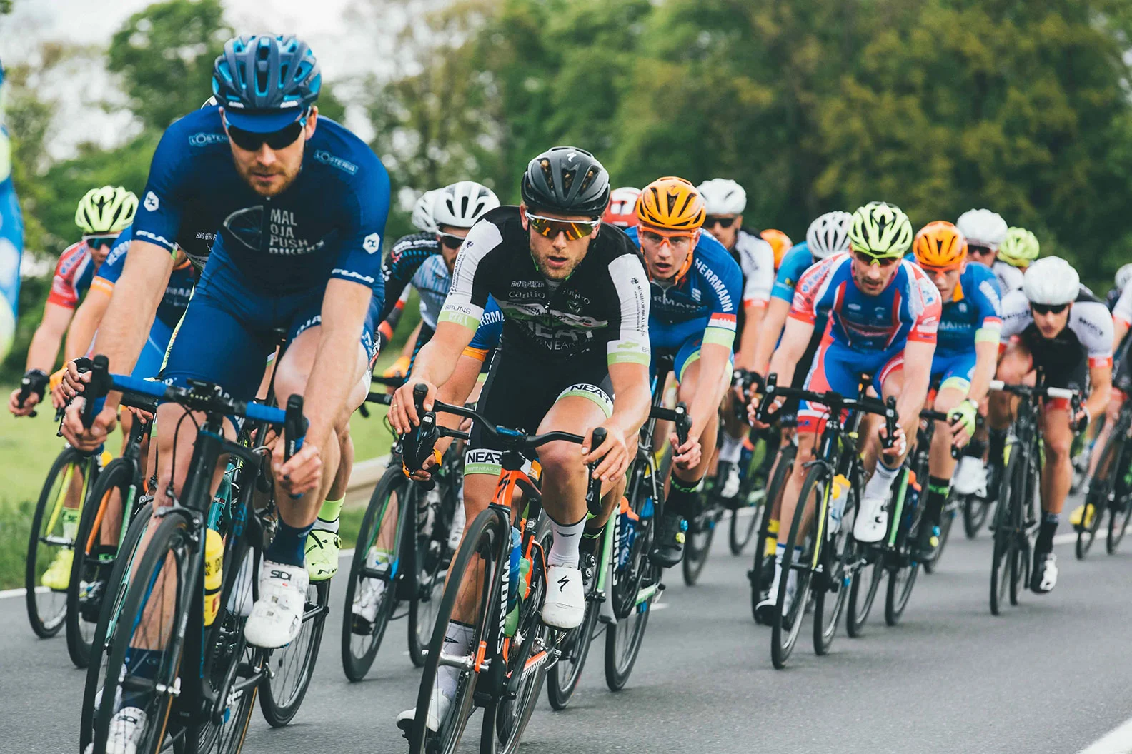 group of people biking forward in a triathlon